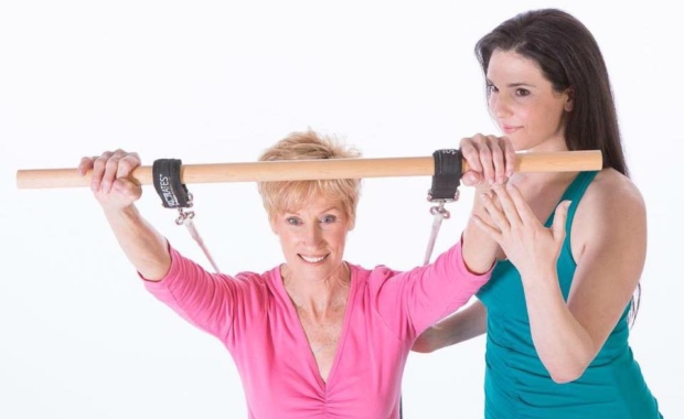Older Adult benefits from Pilates exercise on the Pilates Reformer